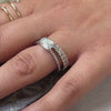 The Adelaide east west emerald diamond engagement ring with the Anistom emerald cut eternity ring on model | Lisa Robin