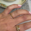 The Allison engagement ring with the Kendal curved wedding ring and the Jamie gold ring on model | Lisa Robin