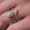 The Laurel Leaf and Vine Diamond Wedding Ring in 14k yellow gold paired with the Talon Curved 14K yellow gold Diamond Wedding Ring on model hand by Lisa Robin jewelry