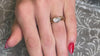 The Mia Oval East est engagement ring with the Vintage Floral Wedding ring on model | Lisa Robin