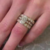 The Samara Half Bezel Oval Diamond Eternity Ring in 14k yellow gold on model hand by Lisa Robin jewelry