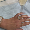 The Robin 3 carat oval side diamond engagement ring styled with Kendal curved round diamond wedding ring by Lisa Robin