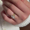 The Delilla Engagement Ring with marquise cut diamond in yellow gold and paired with the Milan twist diamond wedding ring in 14K yellow gold on model hand by Lisa Robin Jewelry