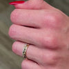 The Jordan Medium Scatter Diamond Wedding Ring in 14k yellow gold on model hand by Lisa Robin jewelry