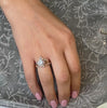 Aatish round 1.0 carat diamond engagement ring in yellow gold with Twilight and Jaden curved wedding rings on model by Lisa Robin