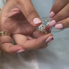 Aatish round moissanite diamond halo engagement ring in 1.0 carat yellow gold with Tara wedding ring on model | Lisa Robin