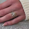 The Evara Twist Diamond Wedding Ring in 14k yellow gold on model hand by Lisa Robin jewelry