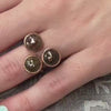 The Trilogy Rose Gold Rustic Diamond Wedding Ring in 14K rose gold on model hand by Lisa Robin Jewelry