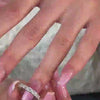 The Mayumi Emerald Cut Eternity Band in 14K white gold on model hand by Lisa Robin Jewelry