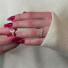Melayna three stone oval cut yellow gold engagement ring paired with Kiran curved gold wedding ring on models hand by Lisa Robin Jewelry