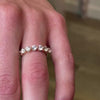 The Taryn Floating 7 Stone Diamond Wedding Ring in 14K yellow gold on model hand by Lisa Robin Jewelry