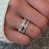The Ensemble Ring Stack Set comprised of the Lindon Princess Cut diamond Eternity Wedding Band in 14K white gold with Jamie 2mm Wide Flat Wedding Ring in 14K white gold and Aniston Emerald Cut Diamond Eternity Wedding Ring in 14K white gold on model hand by Lisa Robin Jewelry