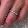 Avery east west emerald cut lab grown eternity 14K yellow gold wedding band on model hand by Lisa Robin Jewelry 