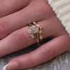 The Kallely bezel Diamond Engagement Ring with oval cut diamond in yellow gold on model hand by Lisa Robin Jewelry
