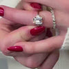 The Aston Art Deco Style Engagement Ring with emerald cut diamond in yellow gold paired with Avery east west emerald cut lab grown eternity 14K yellow gold wedding band on model hand by Lisa Robin Jewelry 