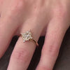 The Revel Halo Diamond Engagement Ring with oval cut diamond in yellow gold on model hand by Lisa Robin jewelry