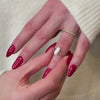 The Quinn Twist Diamond Wedding Ring in 14k yellow gold on model hand by Lisa Robin jewelry