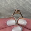 The Ellery Milgrain Bezel Cathedral Engagement Ring with oval cut diamond in yellow gold on model hand by Lisa Robin Jewelry