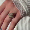The Dorothy Cluster Double Prong Engagement Ring with marquise cut diamond in yellow gold on model hand by Lisa Robin Jewelry