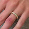 The Samara Half Bezel Oval Diamond Eternity Ring in 14k yellow gold on model hand by Lisa Robin jewelry