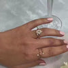 The Revel Halo Engagement Ring with oval cut diamond in yellow gold on model hand by Lisa Robin jewelry 