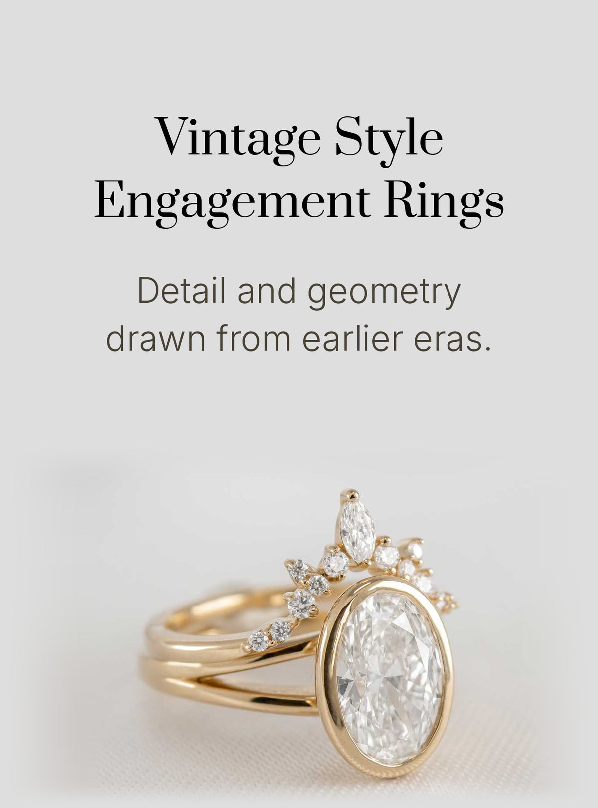 Vintage style engagement rings by Lisa Robin: the Emery bezel set oval diamond engagement ring with the Jaden marquise diamond chevron wedding ring in 14K yellow gold