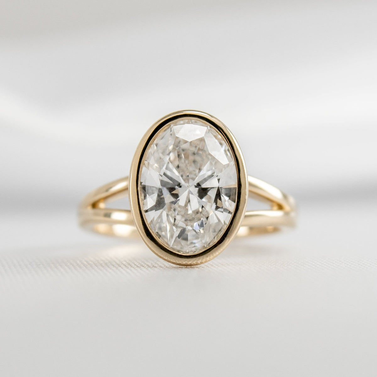 Shown in 1.80 Carat*The Emery Bezel Set Engagement Ring with oval cut diamond in yellow gold by Lisa Robin#color_14k-yellow-gold#shape_oval
