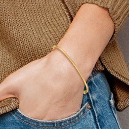 Yellow Gold Hinged Thin Bangle Bracelet on model - Lisa Robin